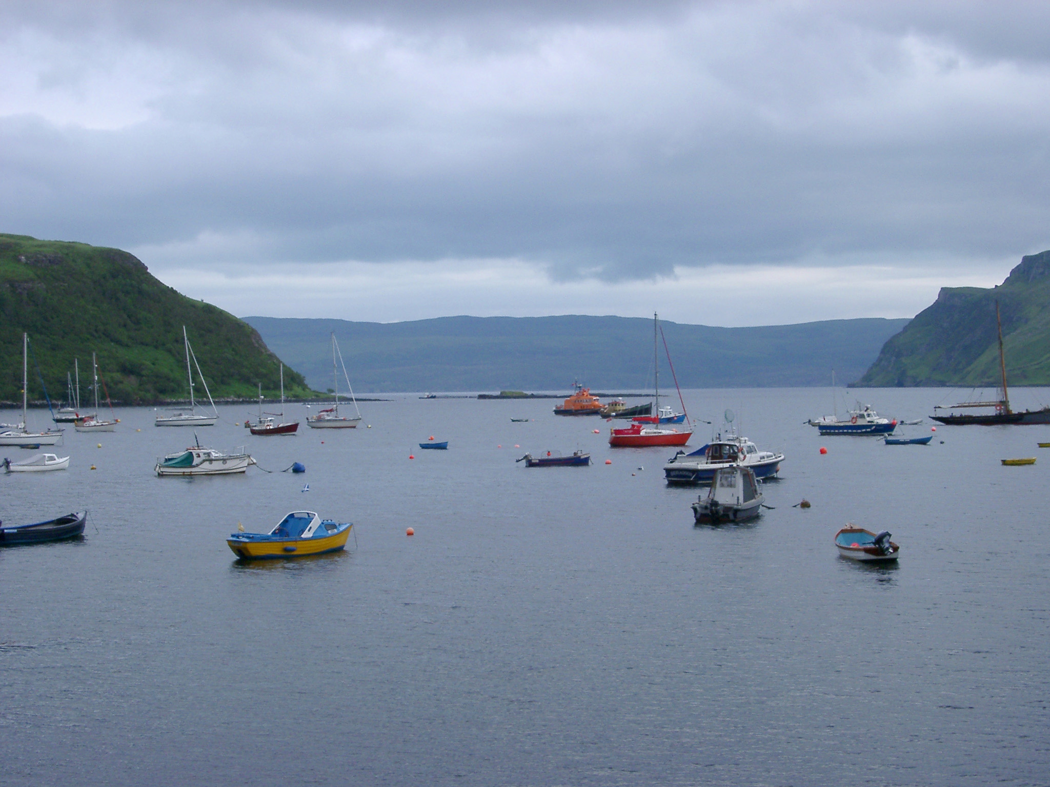an image of fishing and pleasure boats in the harbour at portree, hebrides scotland