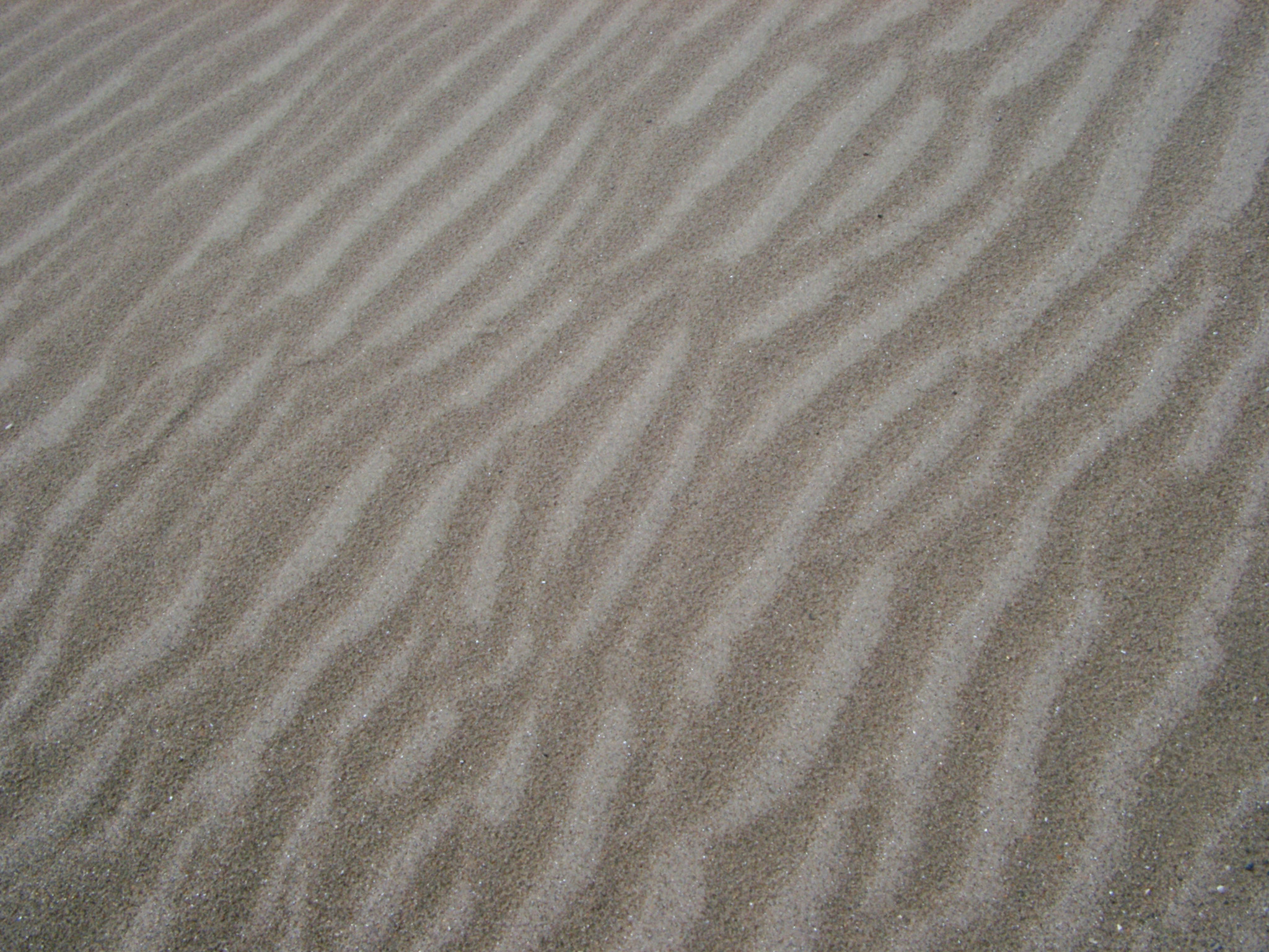an image of Close up Textured Beach Sand with Abstract Design for Wallpaper Backgrounds.