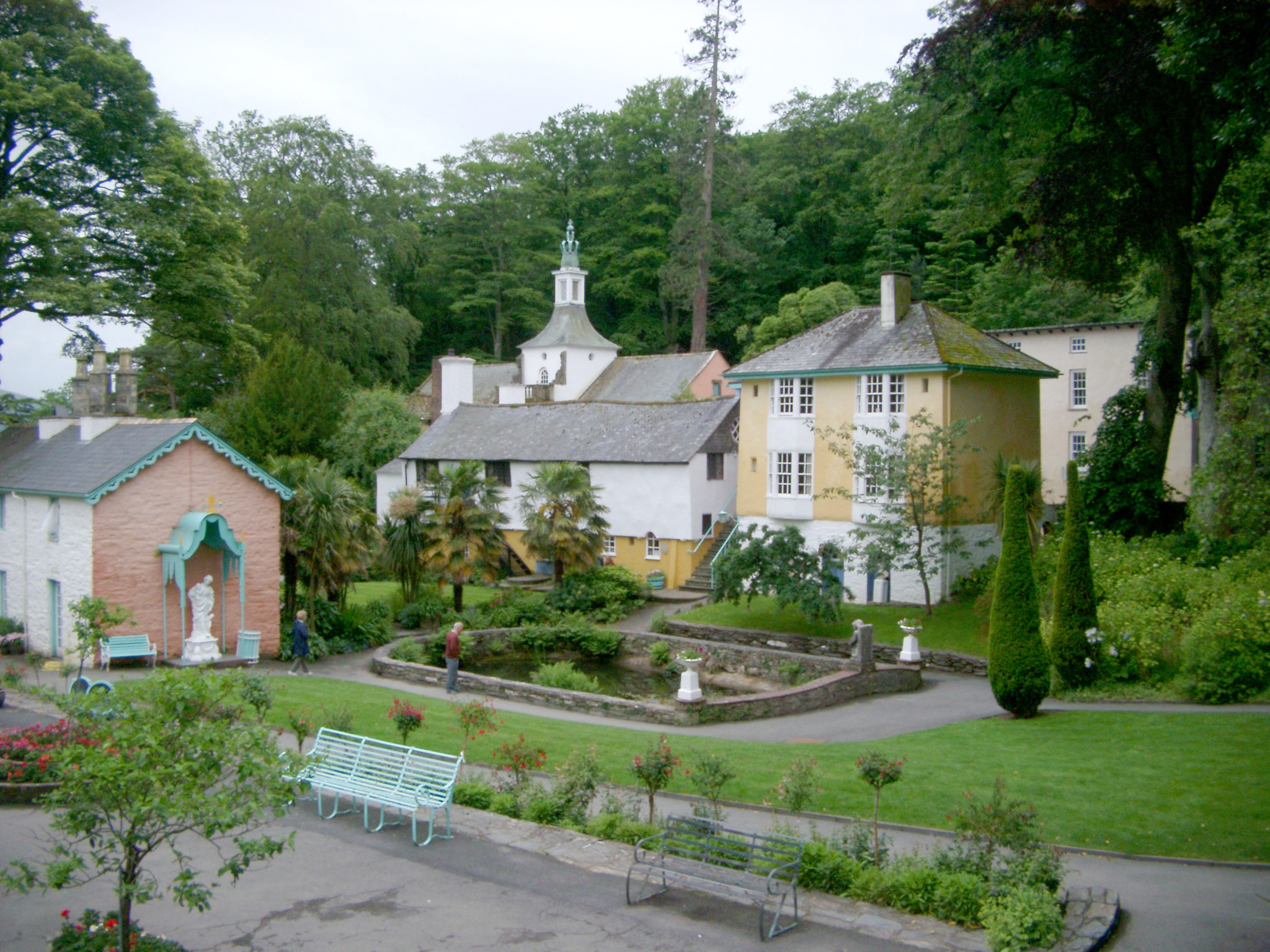 an image of Quaint Buildings and Pond with Green Space in Portmeirion, a Popular Tourist Village in Gwynedd, North Wales