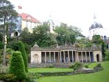 Portmeirion architecture, Wales, modeled on an Italian village , showing a building with a colonnade portico overlooking landscaped gardens in this popular tourist resort