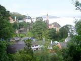 Scenic coastal view of Portmeirion, Gwynedd, Wales, a popular tourist village modelled on an Italian town designed built by Sir Clough Williams-Ellis nestling in lush greenery