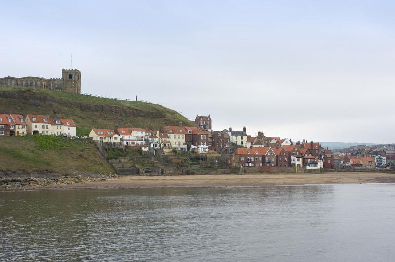 st marys church on top of the east cliff and below the houses on tate hill and tate sands, whitby lower harbour
