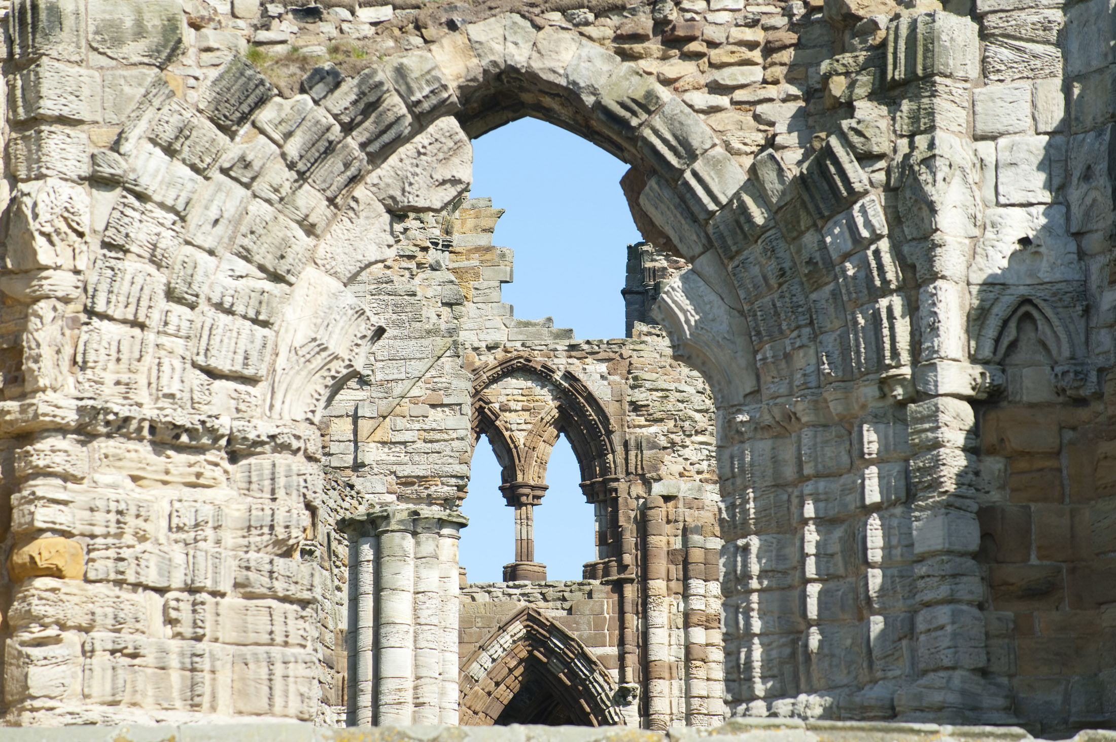 an image of close up on of the ruins of whitby abbey