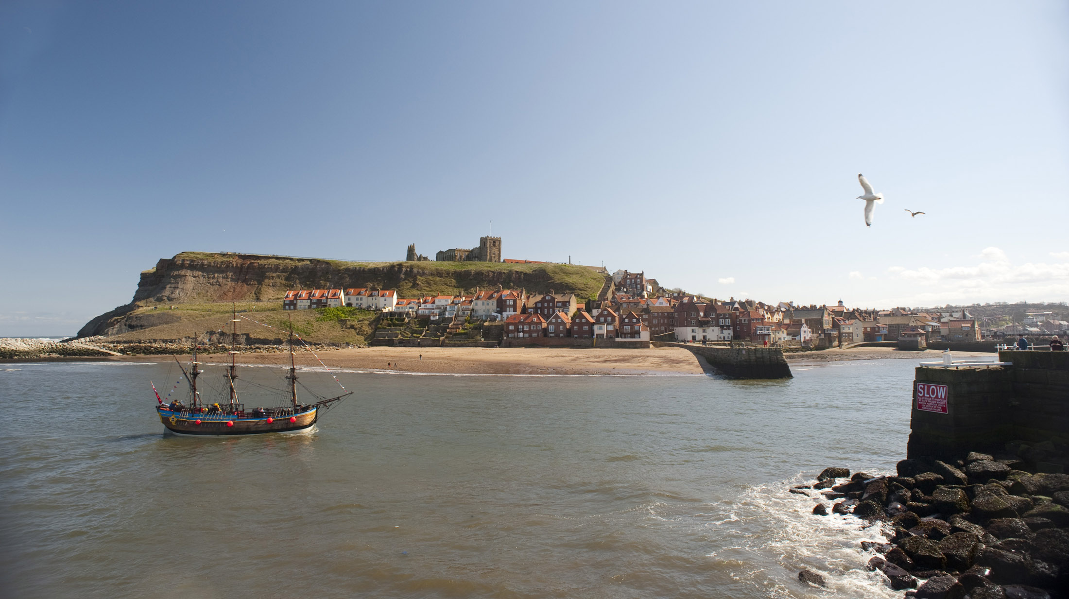 an image of a classic tall ship style vessel on whitby lower harbour