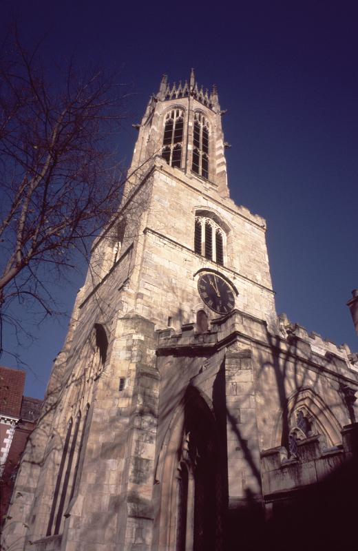 Looking Up at Clock Tower of Historic Medieval All Saints Church in Pavement, York, England