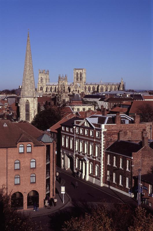 Aerial View of Historic Buildings and Streets at York, England. Captured with Light Blue Sky Background.