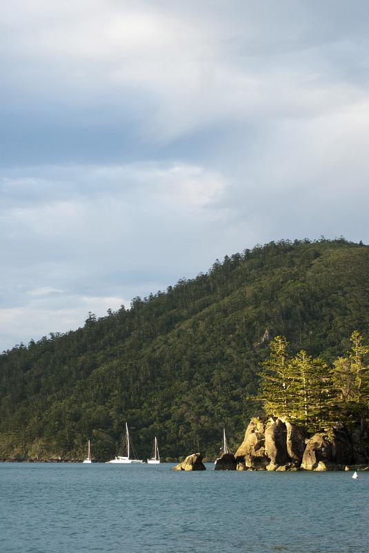 Sailboats sailing by coast of Whitsunday Islands, Australia