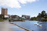 River in the city of Adelaide with high rise buildings in background, Australia.