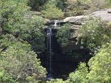 Beautiful Quite Natural Waterfalls Surrounded by Tall Green Trees and Plants.