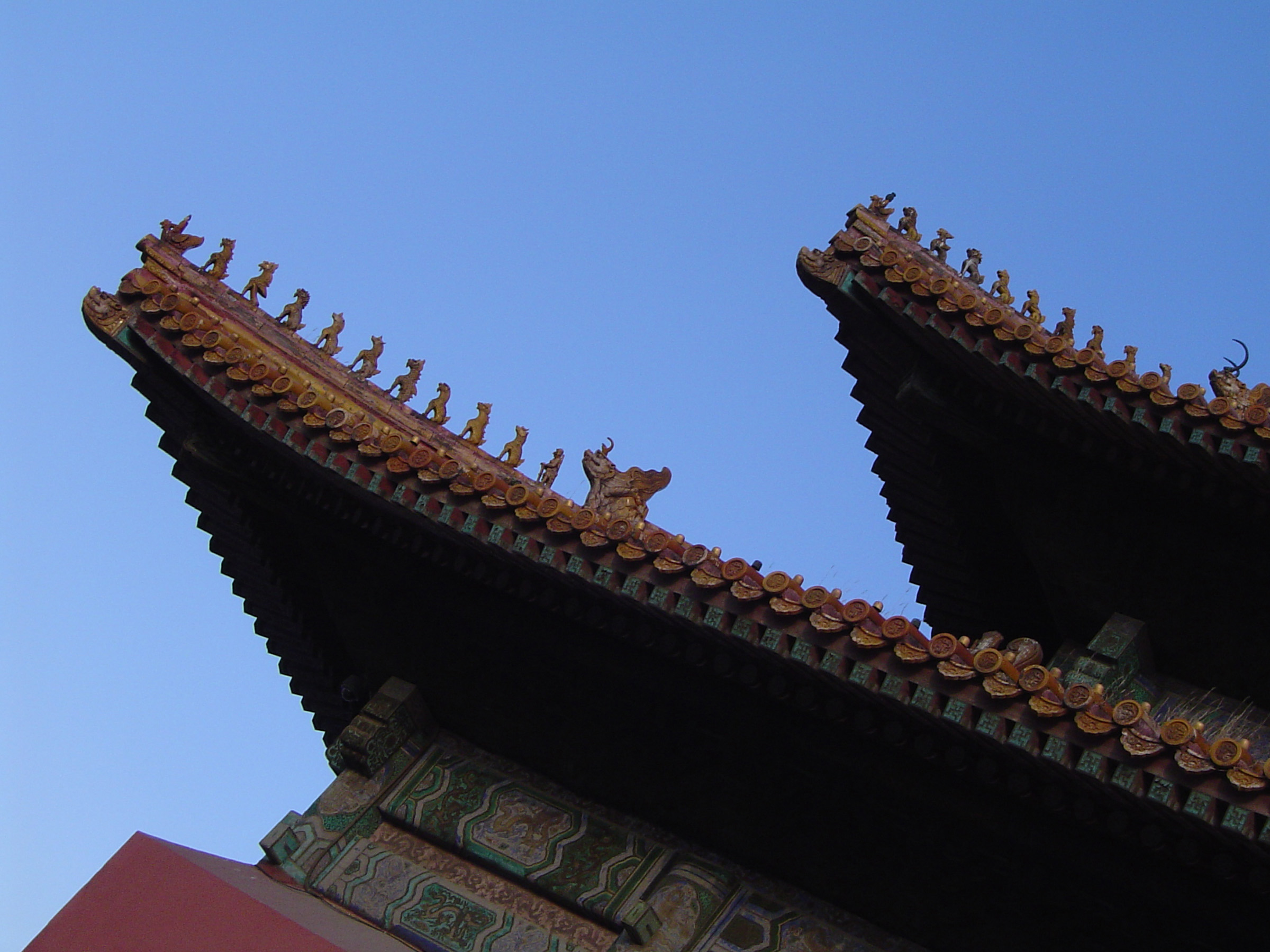 an image of Artistic Details of Famous Vintage The Forbidden City Palace in Beijing, China on Light Blue Sky Background.