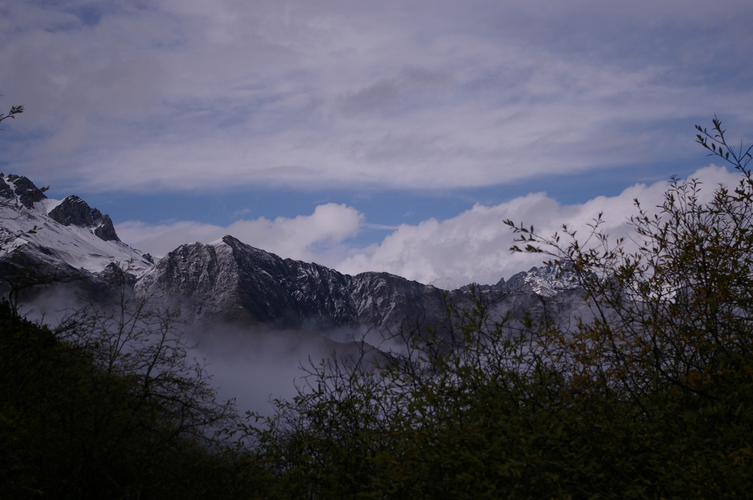an image of Beautiful Attraction of Peaks of Huge Mountains Filled with Snow During Winter Season in China