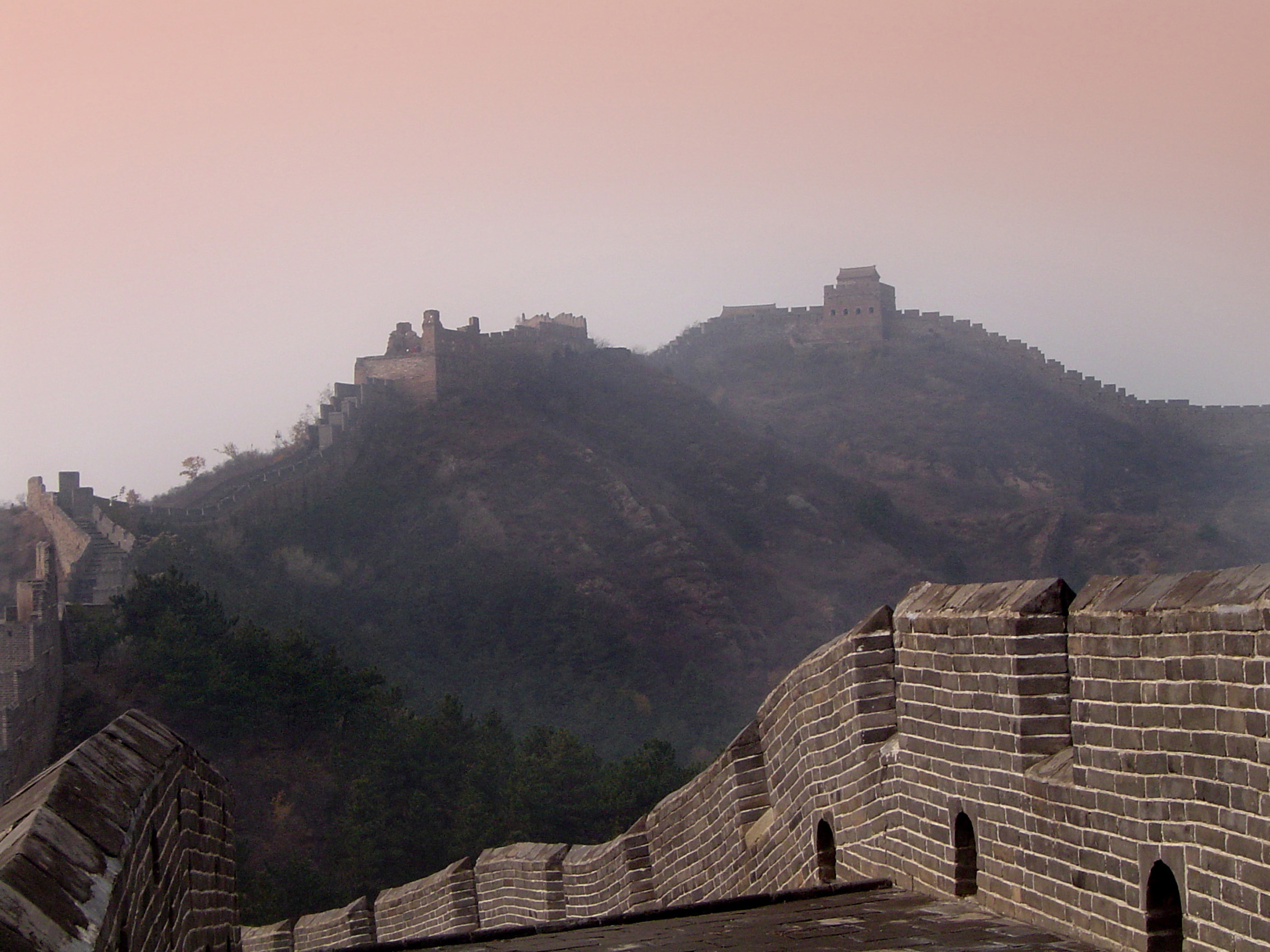 an image of Famous Historic Great Wall of China Structure on Top of the Hills in Panoramic View.