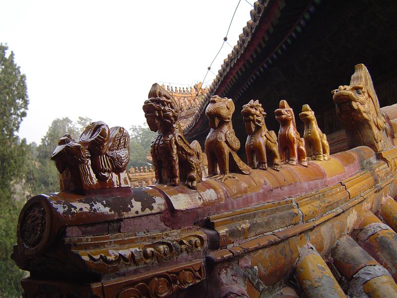 Close up Small Artistic Sculptures at Vintage Temple Roof in China.