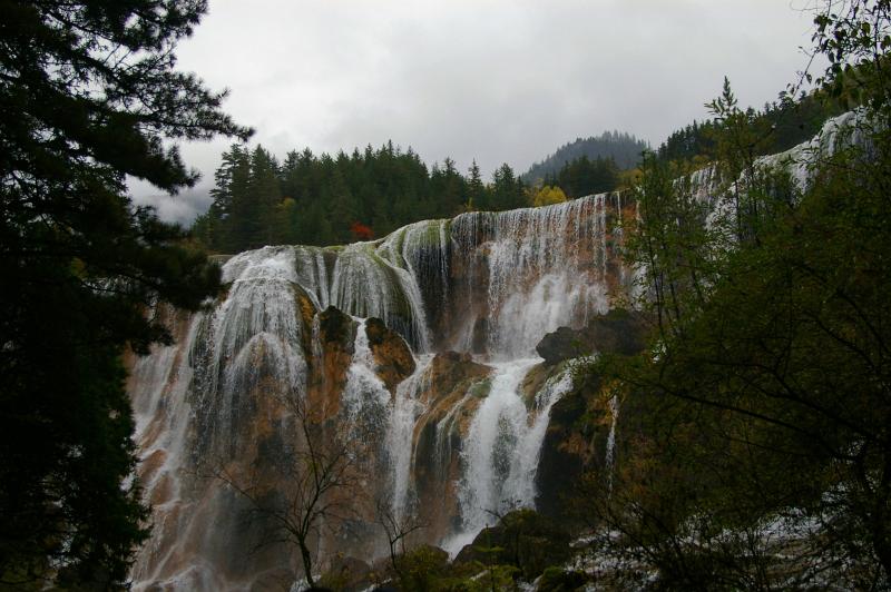Beautiful Attraction of Chinese Waterfalls Surrounded with Green Trees.
