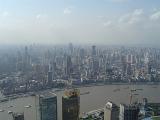 Aerial City View of China with Huge River and Assorted Buildings View. Emphasizing Obvious Air Pollution.