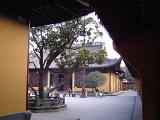 Few Random Visitors at Beautiful Architectural Traditional Chinese Buddhist Temple Building