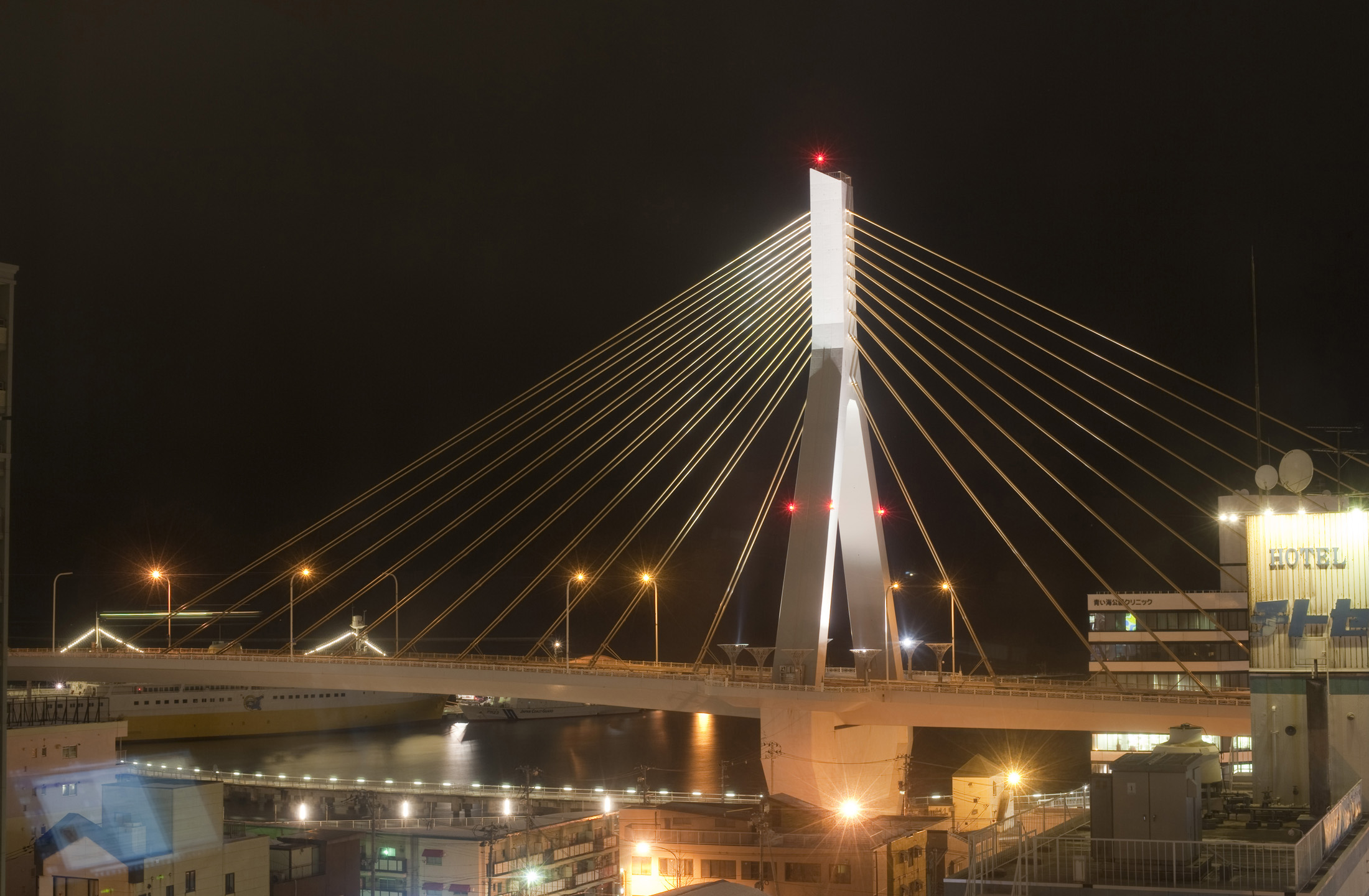 an image of a view of the Aomori Bay Bridge at night, Aomori-shi, Japan