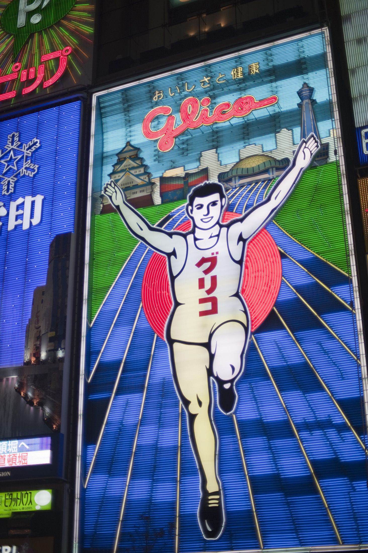an image of the famous Glico man neon sign in DÃÂtonbori at night, Osaka, Japan
