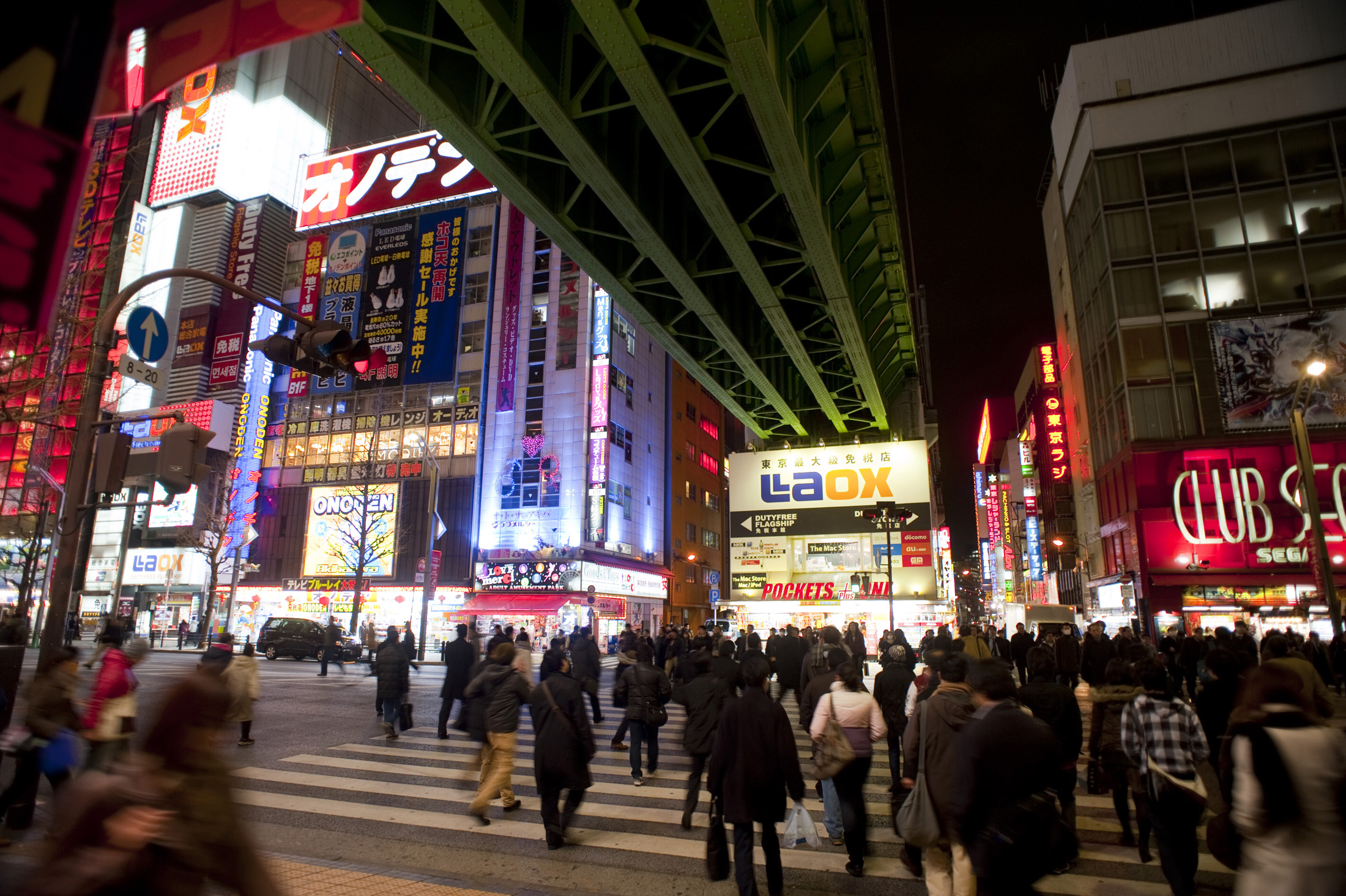 an image of people crossing the road in tokyos electric town district, akihabara