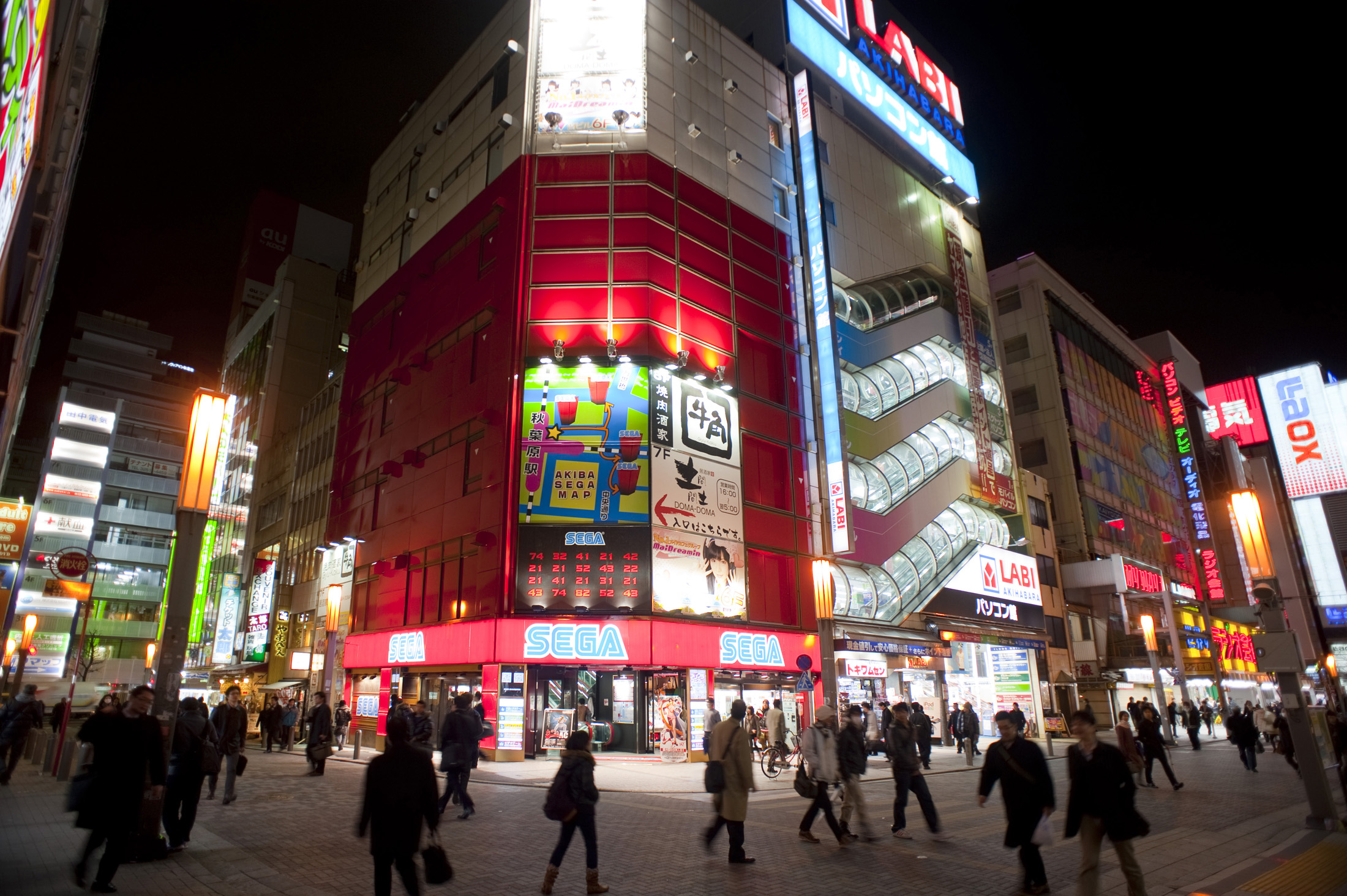 an image of brightly lit stores at night in akihabara - electric town, tokyo, japan