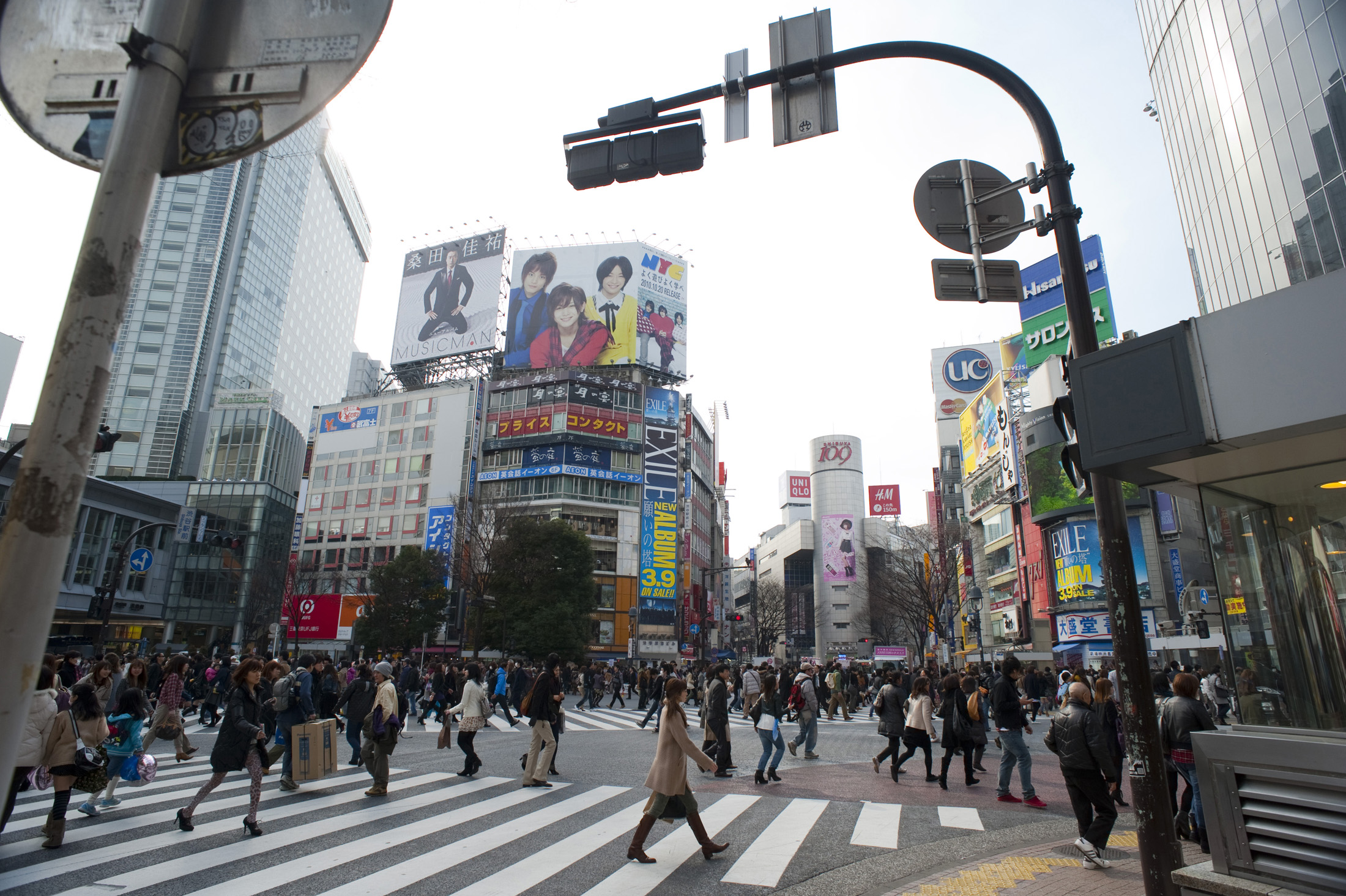 an image of hustle and bustle of urban tokyo in shibuya, tokyo, japan - not model released