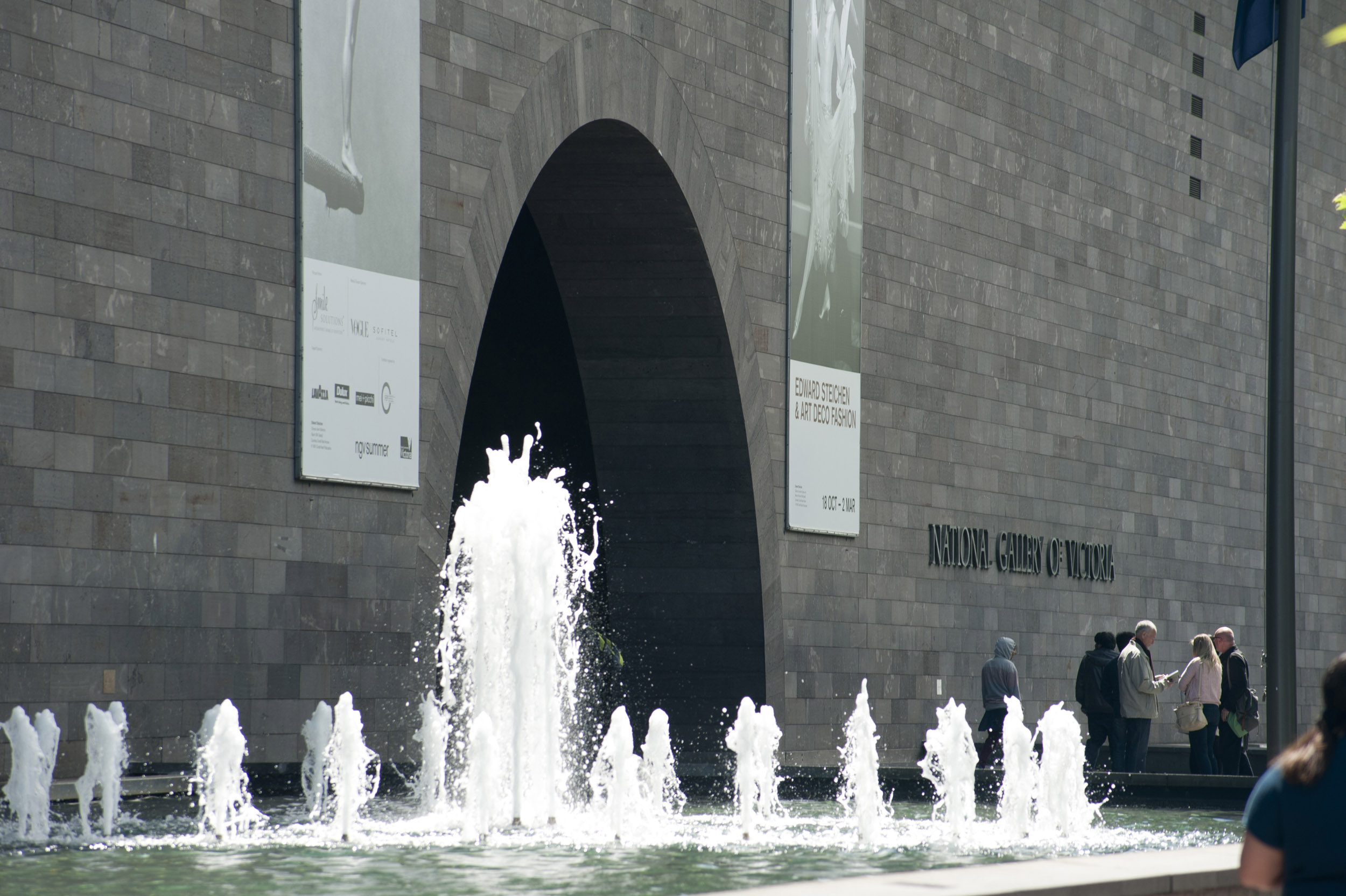 an image of A spouting water feature beside the archway entrance to the National Gallery of Victoria in Melbourne, Australia