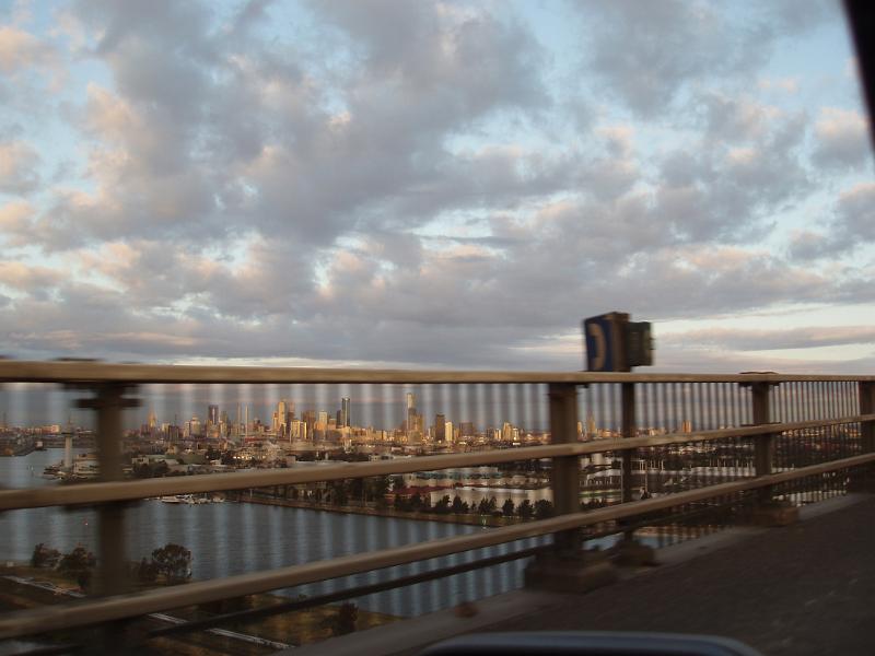 View from Car Traveling Across Bridge into City of Melbourne, Australia at Dusk