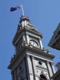 Close up Exterior Peak Design of Fitzroy Town Hall Building in Melbourne on Light Blue Sky background.