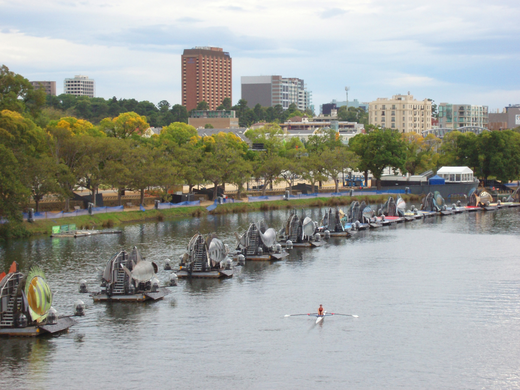 an image of Small Boats on Parade at Yarra River with City Skyline View at Melbourne Australia.