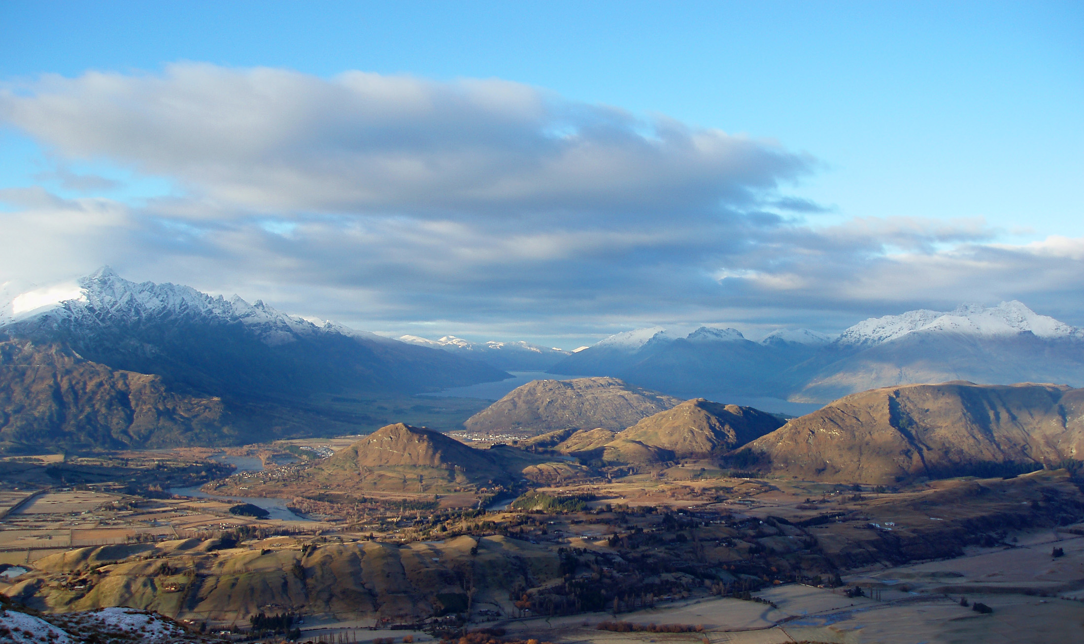 an image of dramatic view of the mountains looking towards queenstown from coronet peak