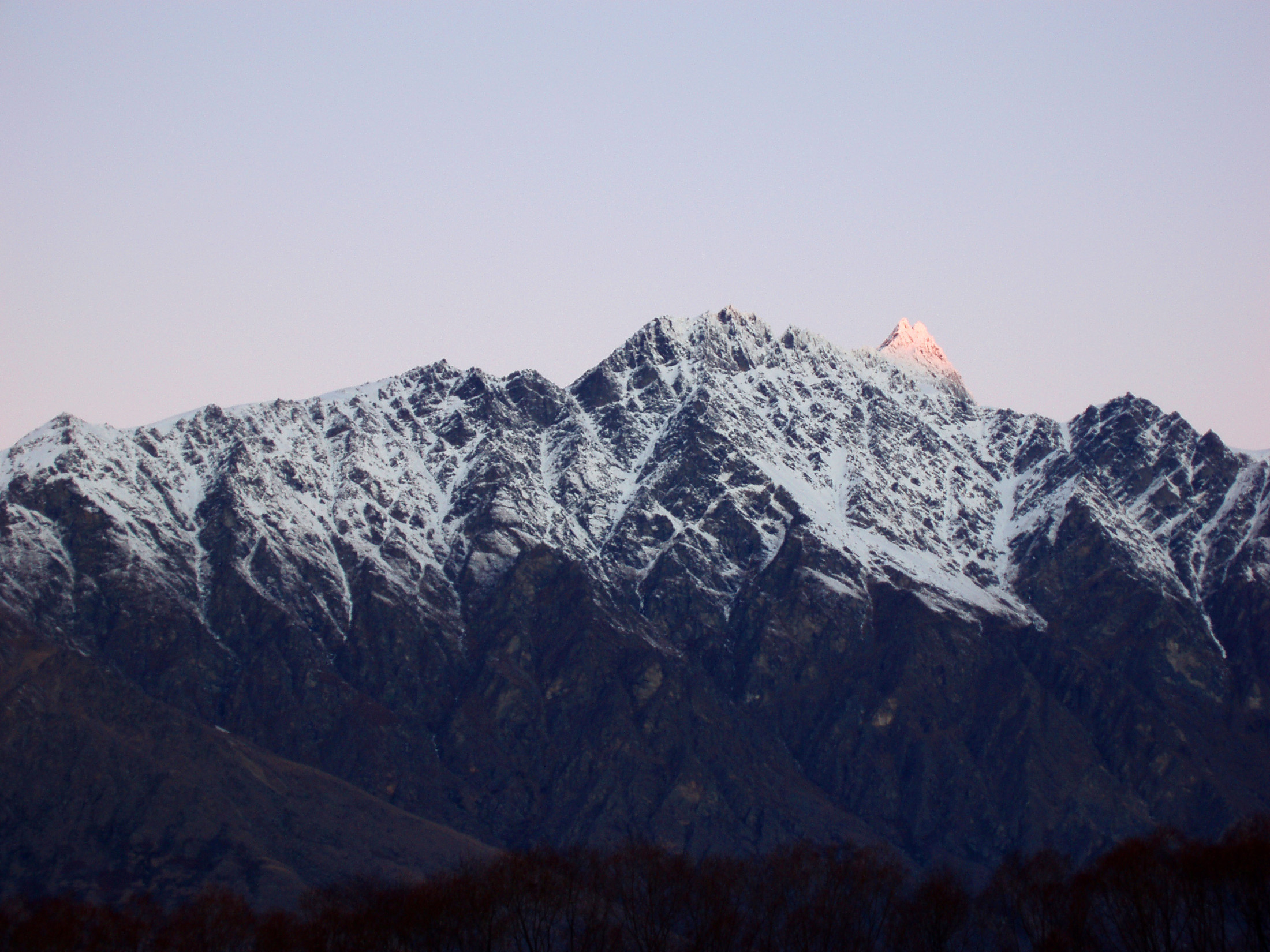 an image of view of the remarkables at sunset,winter in queenstown newzealand