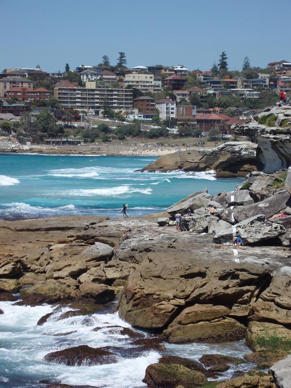 Rocky Australian Beach and Coastline with Buildings Overlooking the Water