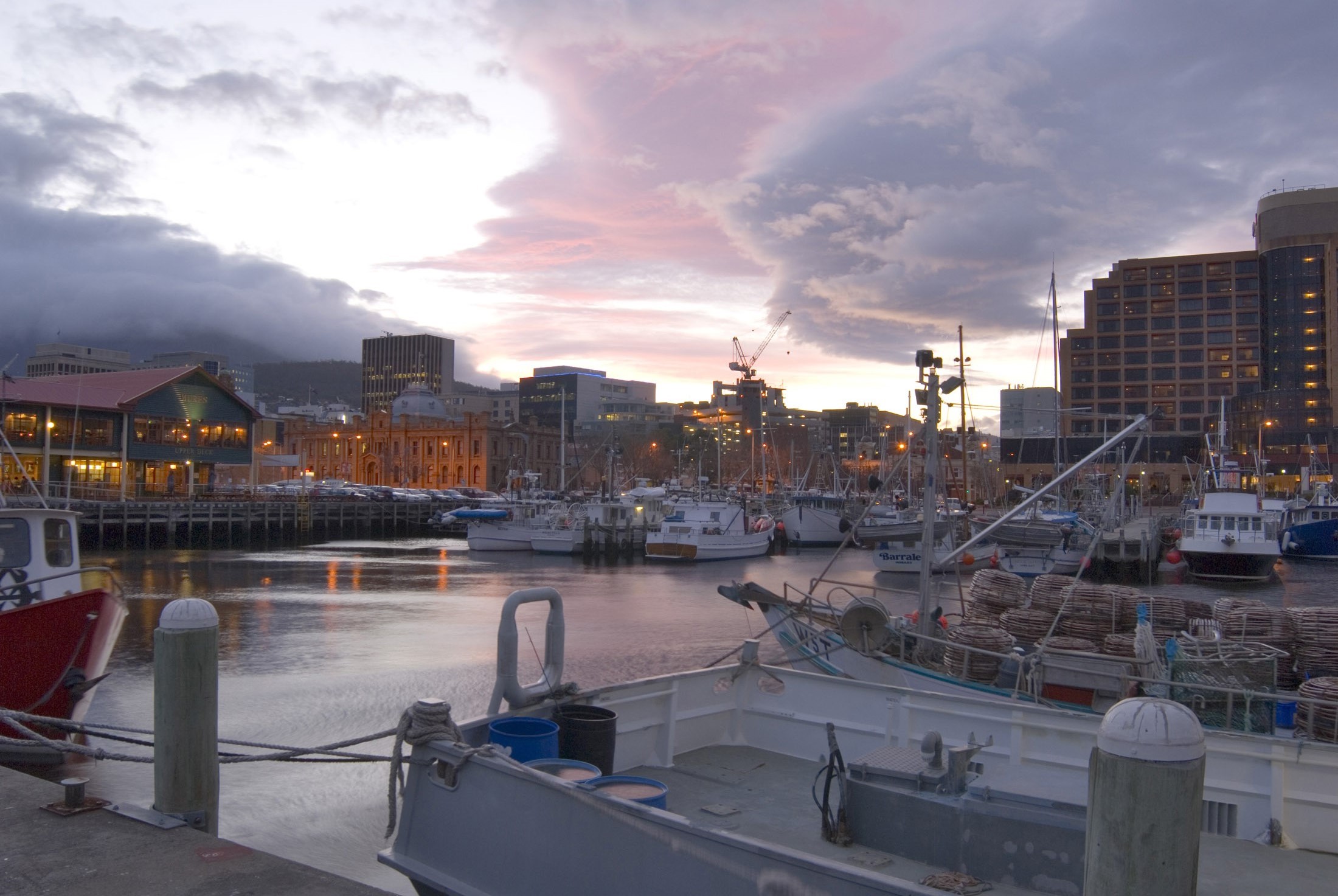 an image of boats moored at constitution dock hobart pictured  at sunset