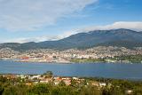 a panoramic view of hobart with mount wellington shrouded in cloud to the rear
