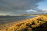 early evening with dark storm clouds over 7 mile beach, hobart, tasmania