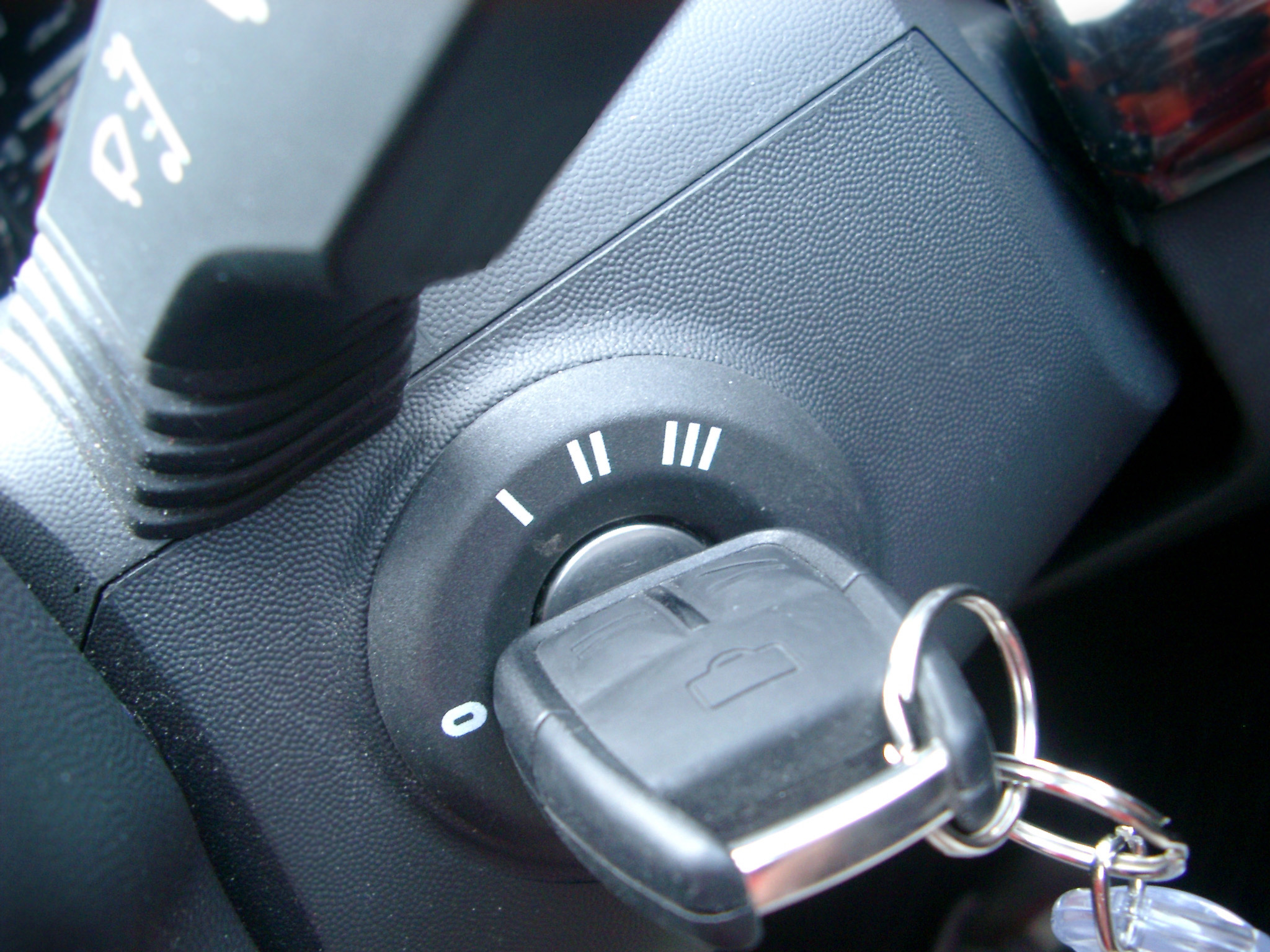 an image of Close Up of Key in Car Ignition in Off Position Shot from Above
