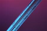 Close up of a thermometer showing the scale on the glass of the tume and the temperature graduations