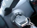 Close Up of Key in Car Ignition in Off Position Shot from Above