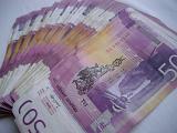 Background of Yugoslav banknotes fanned out in a receding line away from the camera