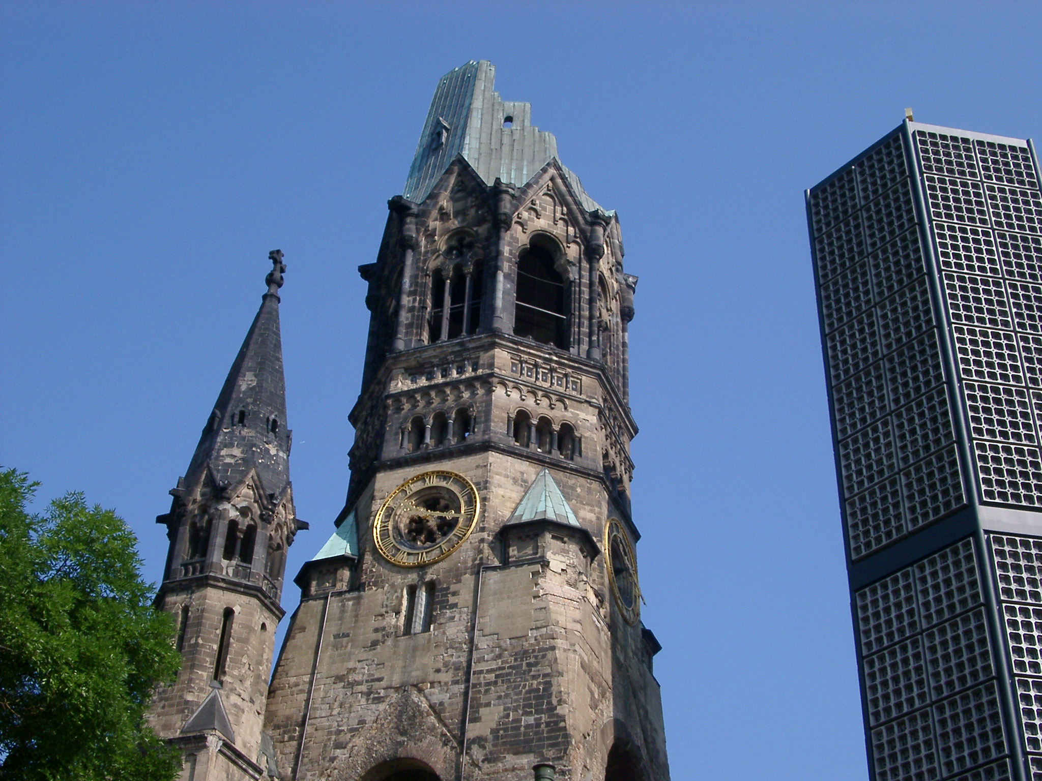 an image of Ruin of Kaiser Wilhelm Memorial Church with New Belfry in Berlin, Germany