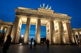 a floodlit view of the brandenburg gate at night