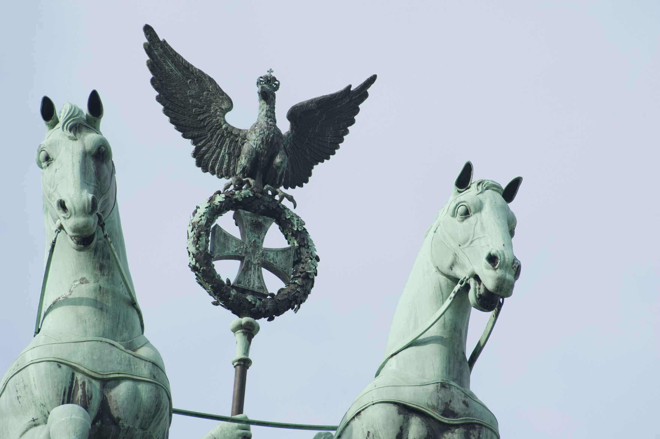 an image of close up on the staff held by Victoria, roman goddess of vistory, on top of the brandenburg gate, berlin, germany