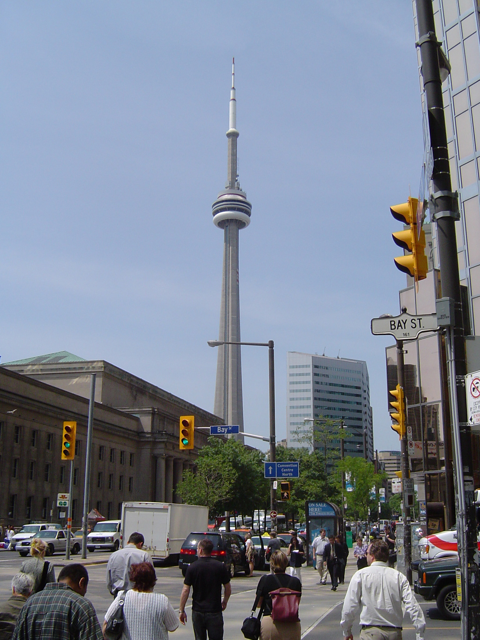 an image of CN Tower and Union Station and Busy City Street in Toronto, Ontario, Canada