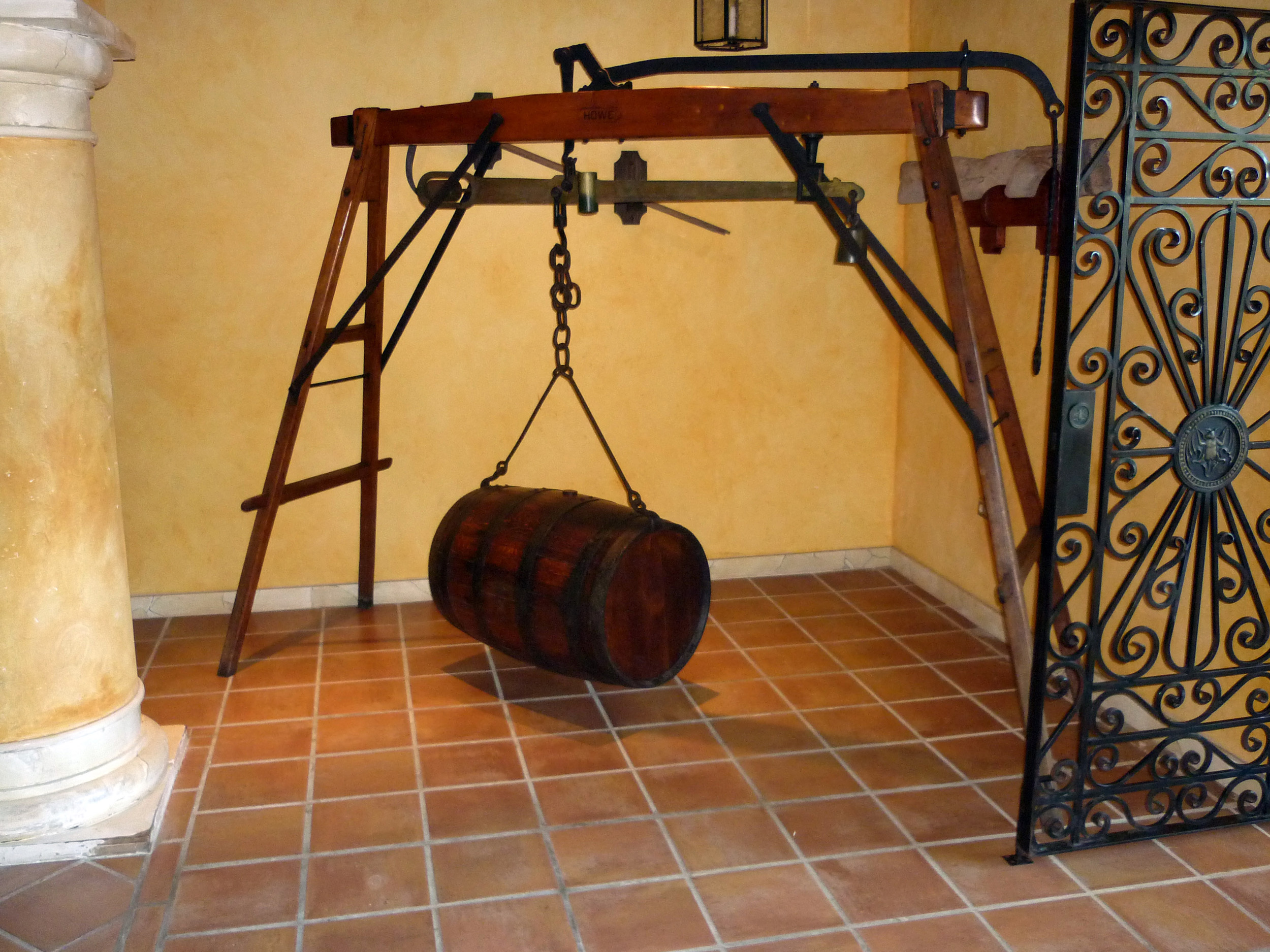 an image of a rum barrel hung from a scale
