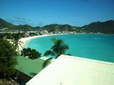looking across a golden sandy beach on the island of st martin