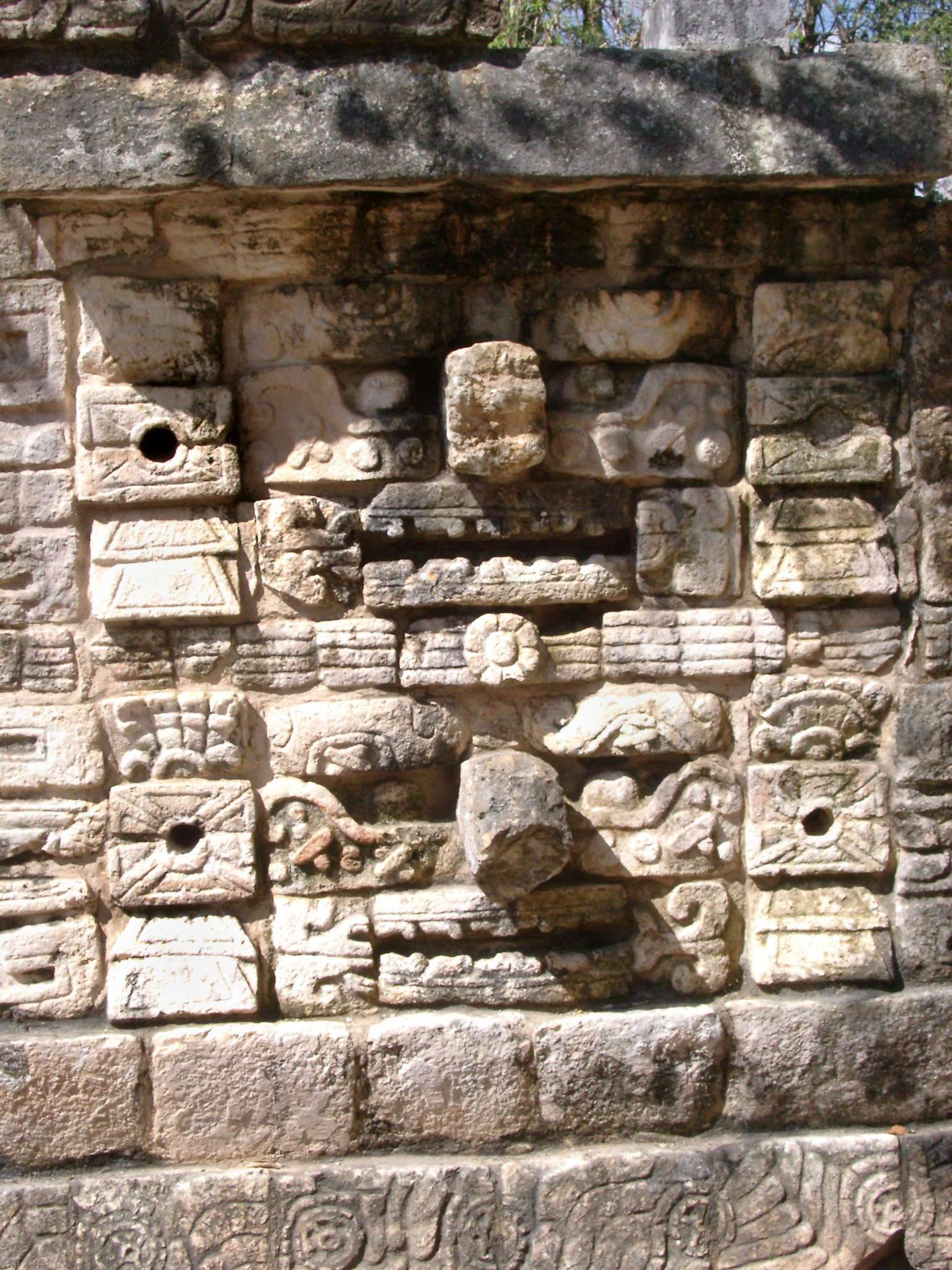 an image of Old carved stone wall with tribal patterns in Chitzen Itza Mayan ruins in the Yucatan Province, Mexico