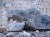 Close up Historic Animal Like Deformed Structure at Chichen Itza. Isolated on Historic Stone Wall Background.