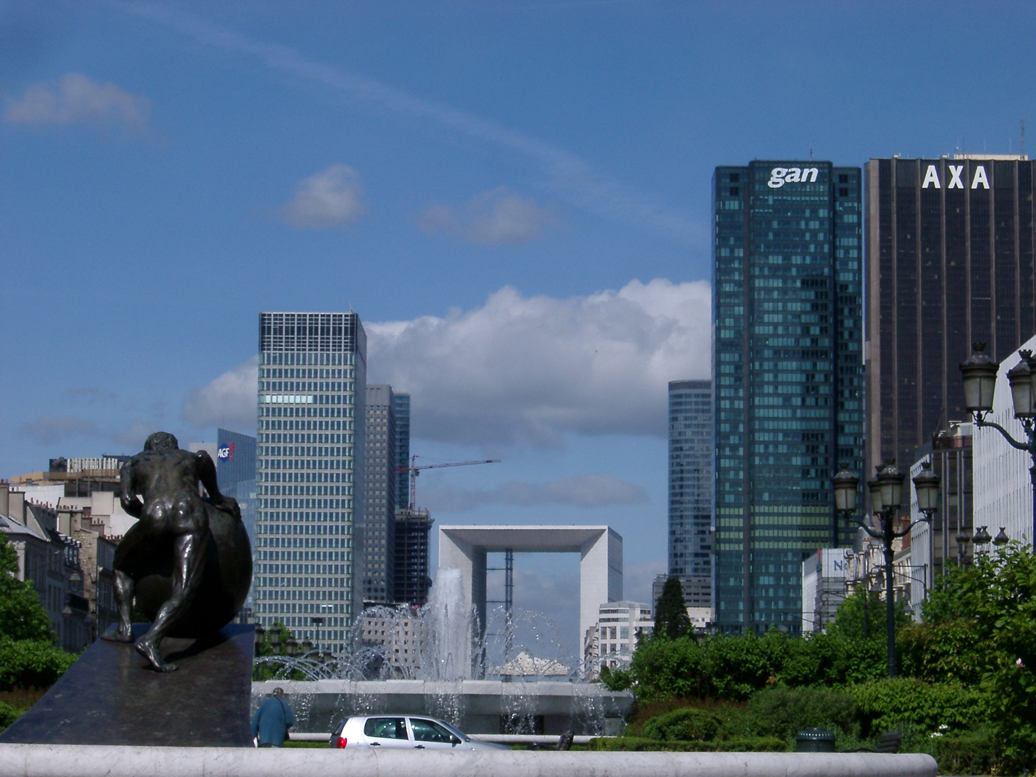 an image of Various Architectural Building Structures at La Defense Isolated on Light Blue Sky Background.