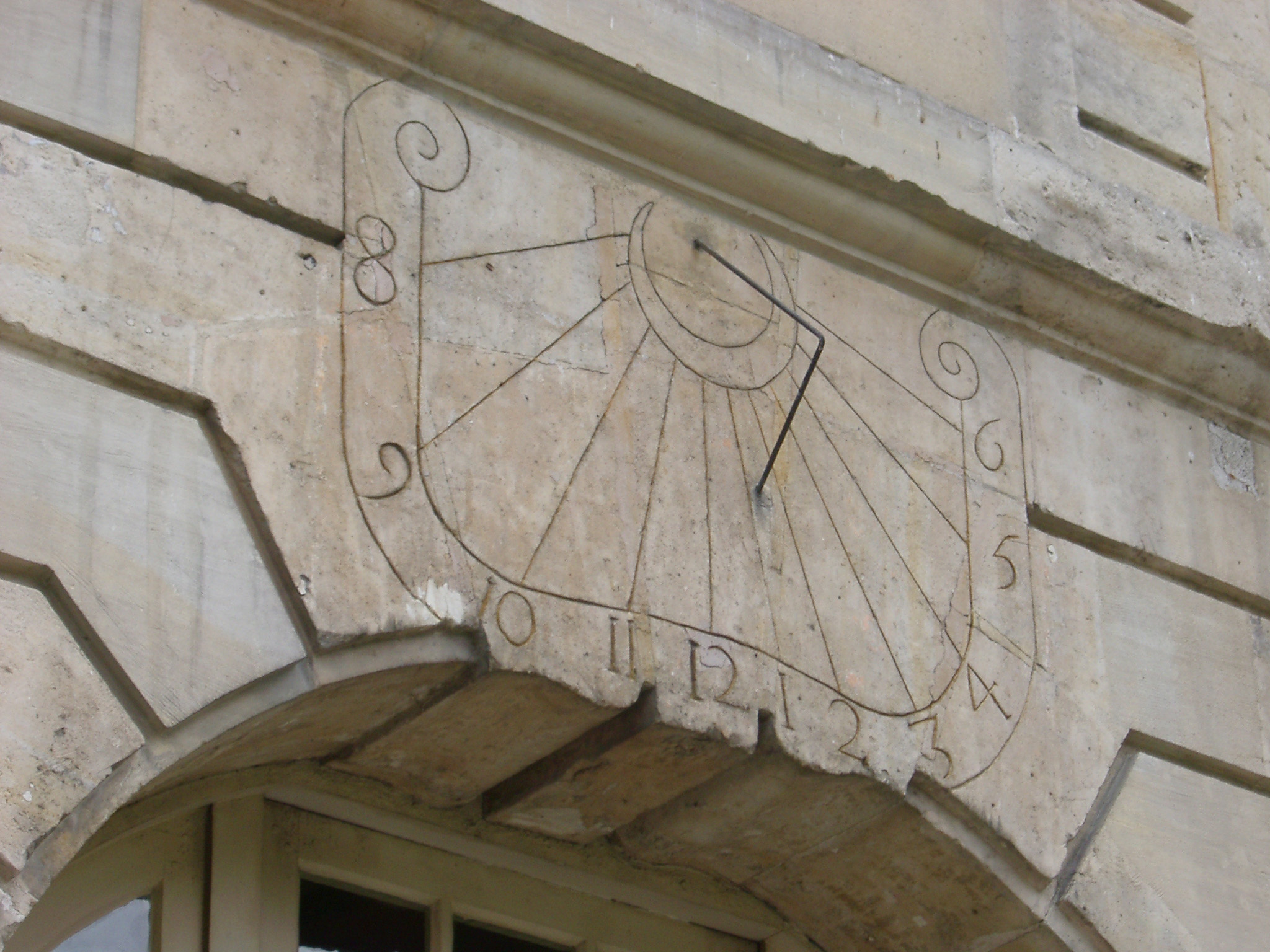 an image of Sundial on Building at Place des Vosges, Paris, France