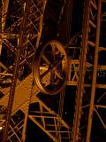 Eiffel Tower structure detail showing the wrought iron lattice framework and wheel